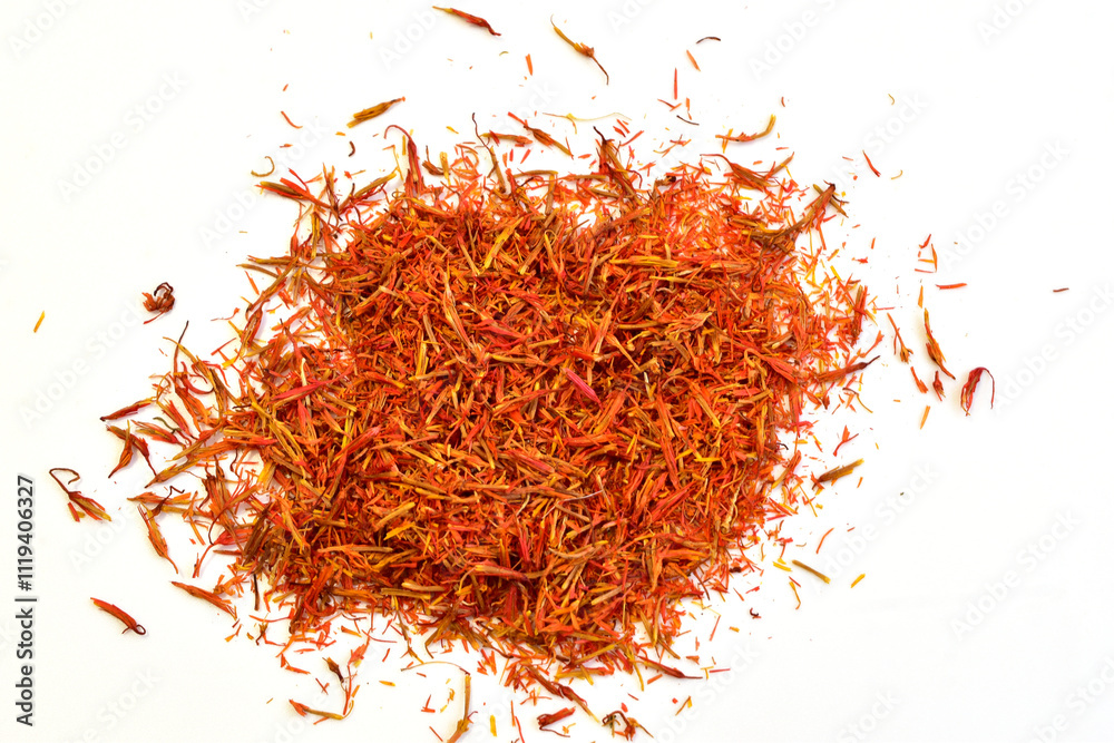 Naklejka premium Spice for cooking ground saffron lies on a white background.