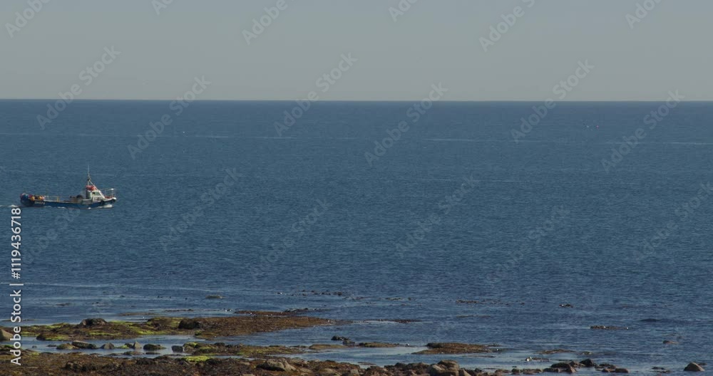 long shot over fishing boats passing through frame at Longhoughton, beach and howdiemony sands, Alnwick long shot over fishing boats passing through frame at Longhoughton, beach and howdiemony sands, Alnwick