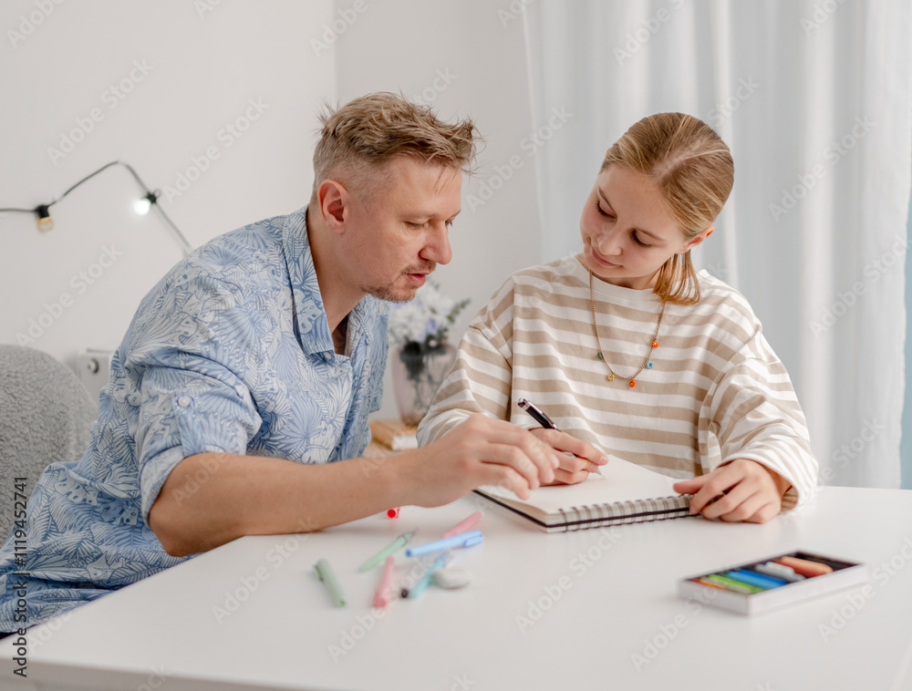 Father Teaches Little Daughter To Draw, Happy Family Have Fun At Home Father Teaches Little Daughter To Draw, Happy Family Have Fun At Home
