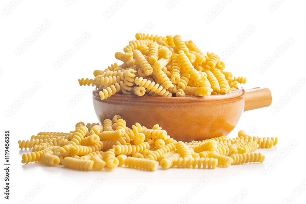 Uncooked italian pasta. Fusilli pasta in bowl isolated on white background. Uncooked italian pasta. Fusilli pasta in bowl isolated on white background.