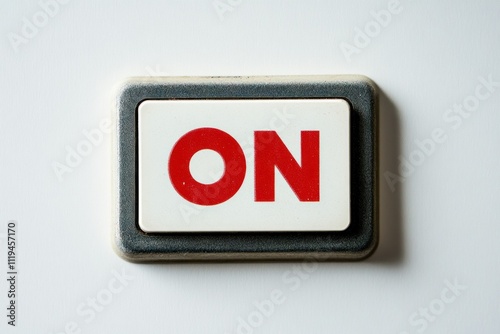 A photograph of an on/off switch with the word "on" written in white and red