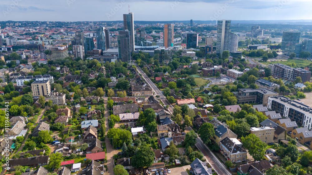 Naklejka premium Aerial Cityscape of Vilnius with Skyscrapers and Traditional Houses