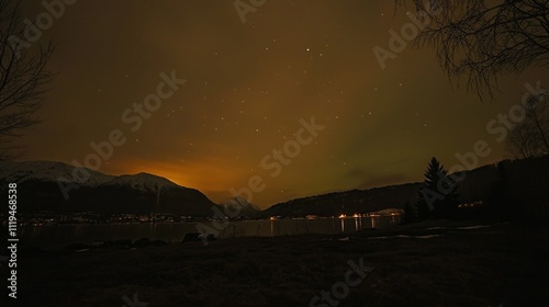 Dancing waves of green and purple auroras fill the sky above Harmony, Norway, as snow-capped mountains and serene waters reflect the stunning nocturnal show, captivating all who witness it