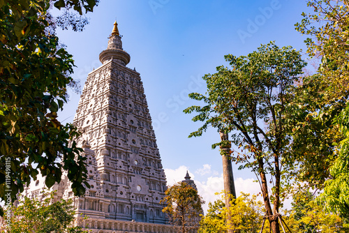 Mockup of Mahabodhi Temple Pagoda from Bodhi Gaya India with Ashoka Pilla sat Wat Chong Kham in Ngao District, Lampang Province, Thailand.