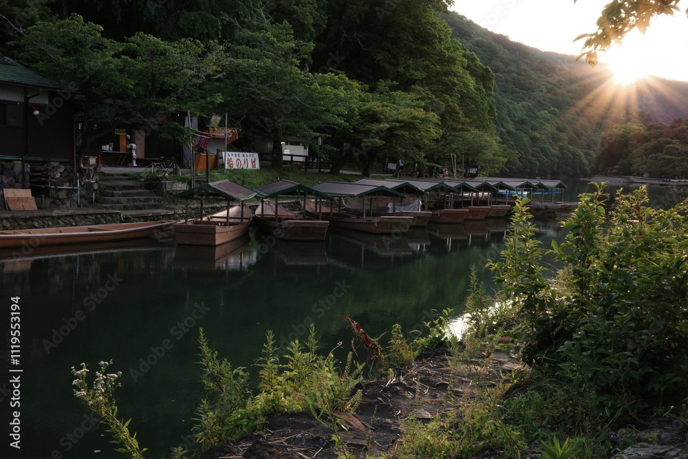 Naklejka premium Japan Travel: Scenic River with Boat and Beautiful Natural Surroundings