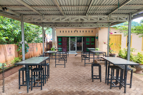 Chairs and tables in front of the minimarket photo