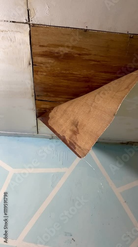 The house ceiling made of plywood peeled off due to rainwater. The house ceiling leaked. Water came out of the peeled off ceiling. House The plywood ceiling peeled off