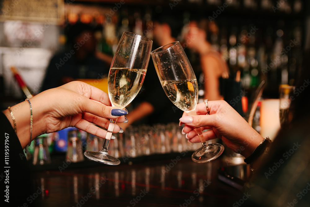 women's hands cheers with glasses of champagne women's hands cheers with glasses of champagne
