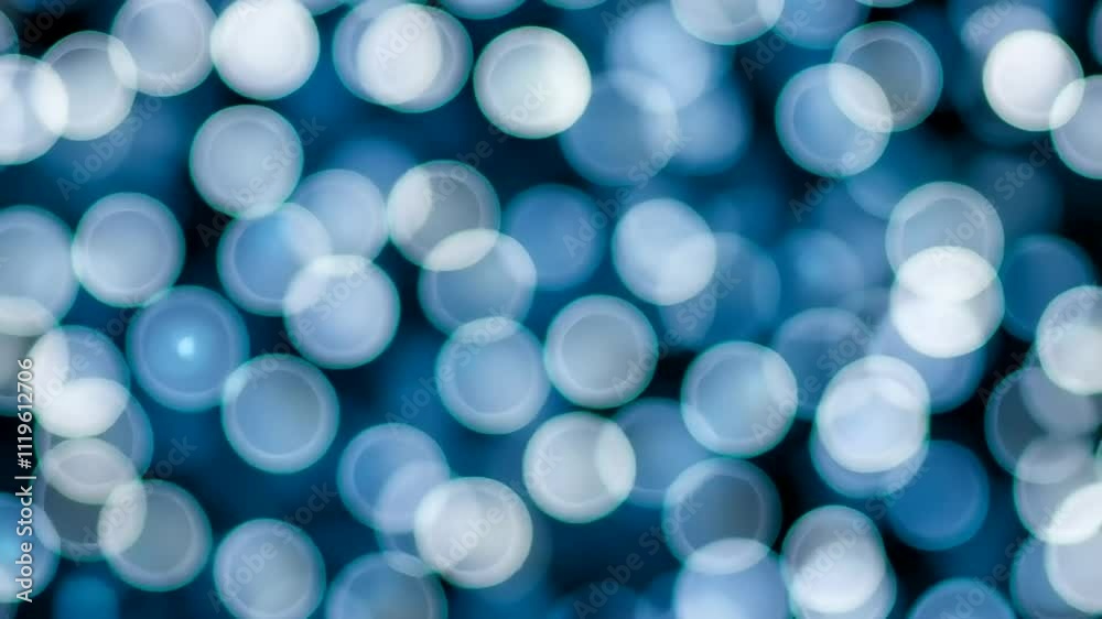 Blue and white bokeh lights create a dreamy background ideal for Christmas or New Year's themes Blue and white bokeh lights create a dreamy background ideal for Christmas or New Year's themes