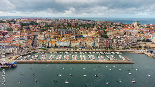 Spectacular aerial view of Santander Port. Panoramic view over promenade of the city. Turquoise water colour. Famous travel destination in North of Spain. Cloudy day. Aerial photography.