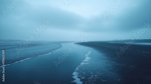 Serene coastal inlet on a misty day.