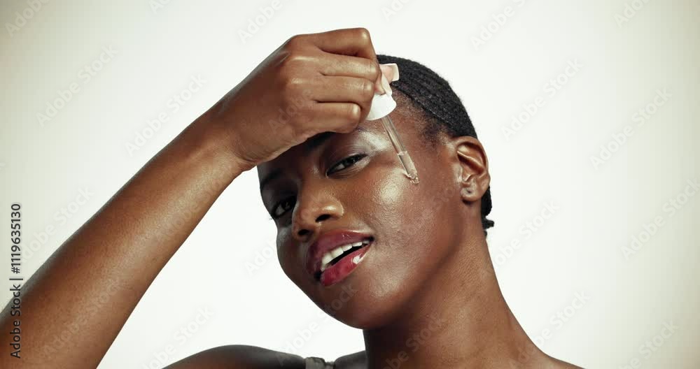 Studio, black woman and skincare with oil for face, dermatology and clean shine for wellness. Female person, portrait and dropper with serum for facial cosmetics, hyaluronic acid by white background Studio, black woman and skincare with oil for face, dermatology and clean shine for wellness. Female person, portrait and dropper with serum for facial cosmetics, hyaluronic acid by white background