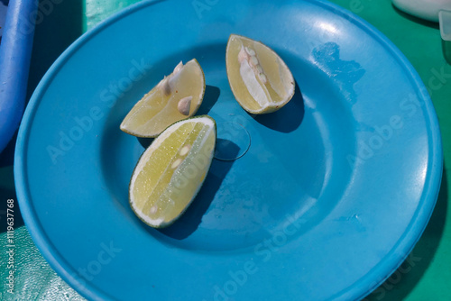 Sliced ​​lime on a small plate on the dining table