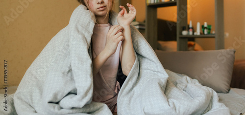 Close up of sick child with skin rashes is scratching from an itch in bed. Allergic reaction, Drug allergy, Scarlet fever, Atopic dermatitis, Diaper rash, Urticaria, Scabies, Heat rash.