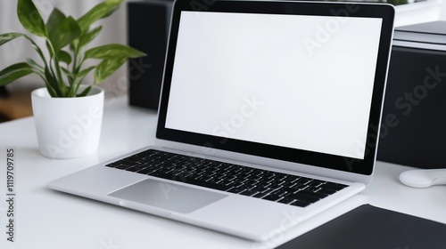 Laptop monitor mockup and pot plant on employee table. Portable personal computer template in office advertising image. Digital screen mock up indoors product photorealistic