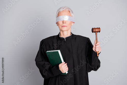 Konstfotografi Photo of old woman judge with closed eyes hold book raise gavel isolated grey co
