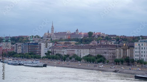 Budapest, Hungary - October 10, 2024: Stunning Fisherman's Bastion with Matthias Church Gothic Architecture. Evening view from the Margit Bridge on Danube river. Cityscape of Budapest.