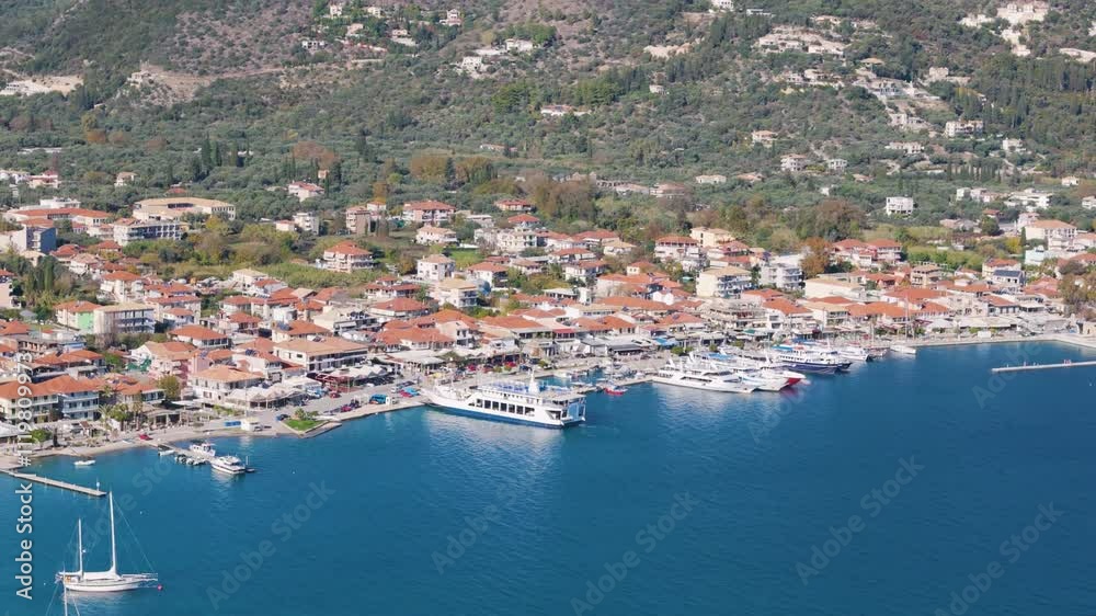 Aerial drone view of the coastal town of Nydri on the island of Lefkada in Greece. Aerial drone view of the coastal town of Nydri on the island of Lefkada in Greece.