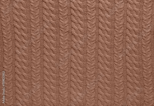 Texture of smooth knitted sweater with pattern. Handmade knitting wool or cotton fabric texture. Background of Large knit pattern with knitting needles or crochet.  Mocha Mousse colour of 2025 year photo