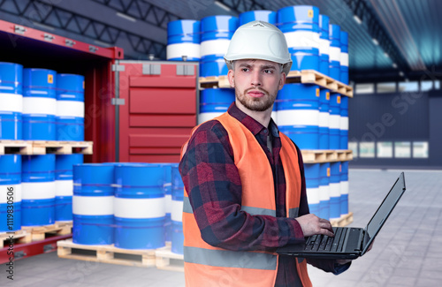 Man logistician near barrel...
