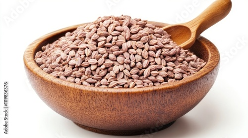 Ajwain seeds in a wooden bowl with a spoon on a white background showcasing natural spices for culinary and health uses photo