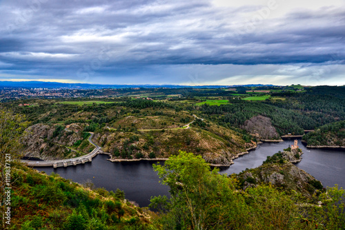 Saint-Victor-sur-Loire, France - October 5th 2024 : View of the River la Loire from a mountain close to Saint-Victor. You can see Grangent Castle, Grangent dam and the city of Andrézieux-Bouthéon.