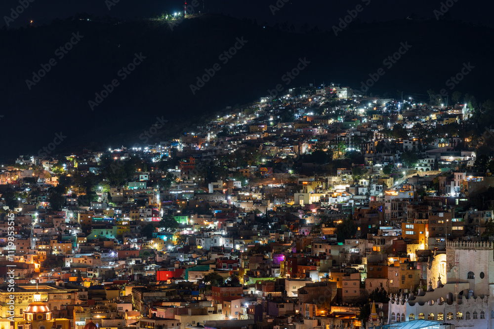 Fototapeta premium Colorful dense houses in Guanajuato, Mexico at night