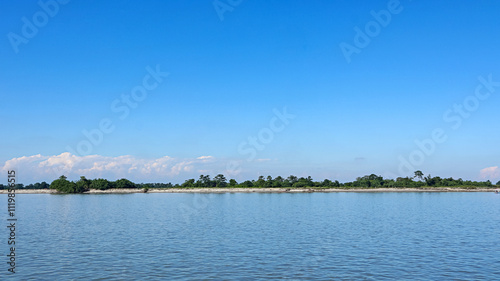 Scenic view of the mighty Brahmaputra River with a boat, Majuli, Assam, India. Majuli is largest river island in the world.