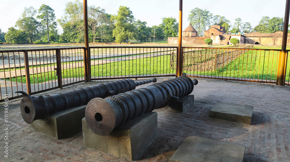 Display of Ahom-period cannons at Talatal Ghar, Sivasagar, Assam, India. Display of Ahom-period cannons at Talatal Ghar, Sivasagar, Assam, India.