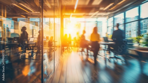 Blurred view of a modern office environment with people present.