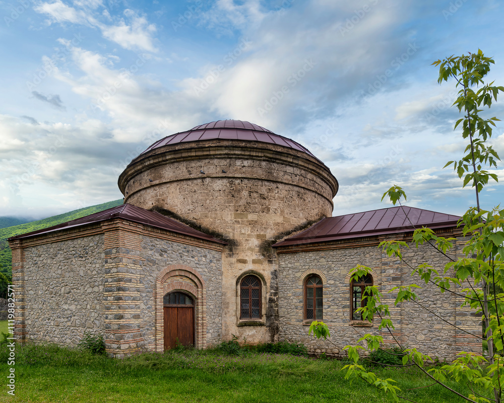 The Round Temple, or Three Saints Church, near the Palace of Shaki Khans in Shaki, Azerbaijan, stands against a clear blue sky The Round Temple, or Three Saints Church, near the Palace of Shaki Khans in Shaki, Azerbaijan, stands against a clear blue sky