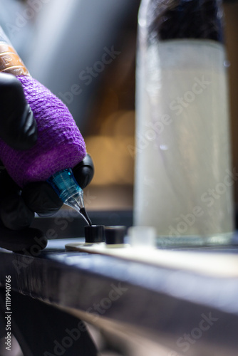 Wallpaper Mural Close-up shot of a tattoo artist using a tattoo machine to create a detailed design on a client’s arm, with a focus on the purple stencil and black gloves. Perfect for tattoo art, creativity, and life Torontodigital.ca