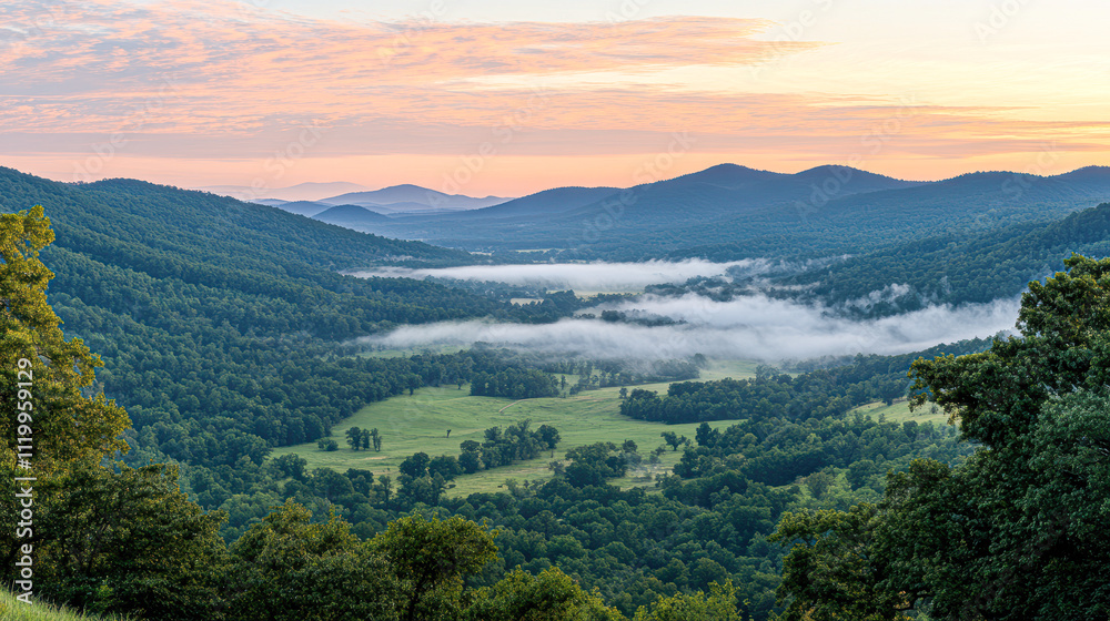 A mountain range with a foggy sky and a lush green valley A mountain range with a foggy sky and a lush green valley