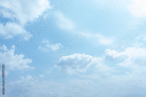 Fototapeta Naklejka Na Ścianę i Meble -  Serene Blue Sky with Fluffy White Clouds Nature Background