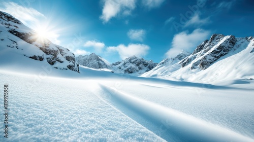 A breathtaking view of pristine snowy mountains stretching under a vibrant blue sky, with sunlight casting shimmering highlights on the snow's surface. photo