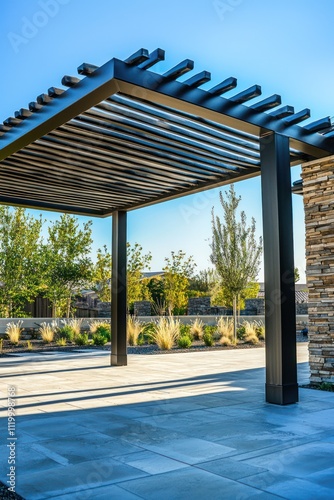 A modern pergola providing shade at the entrance of a newly built residential structure.