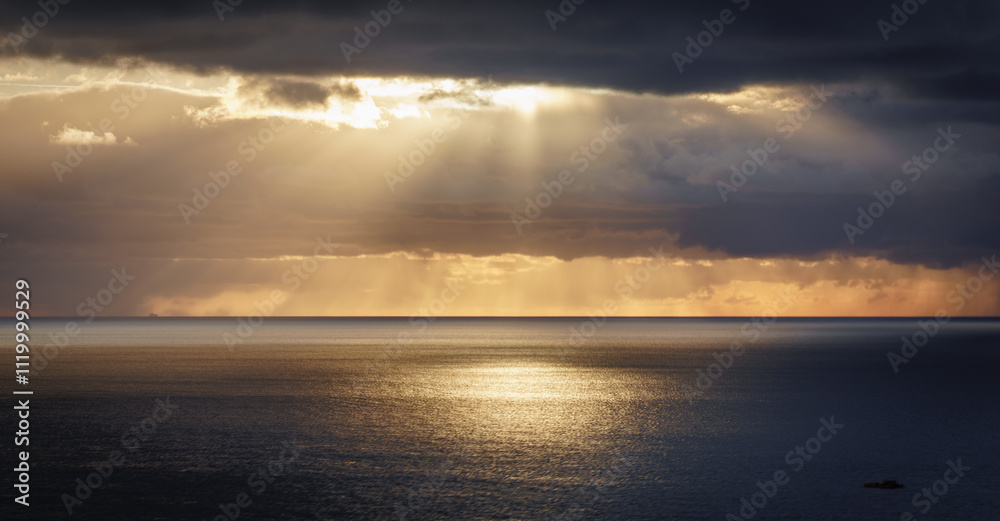 Sunbeams over the ocean on Anglesey North wales