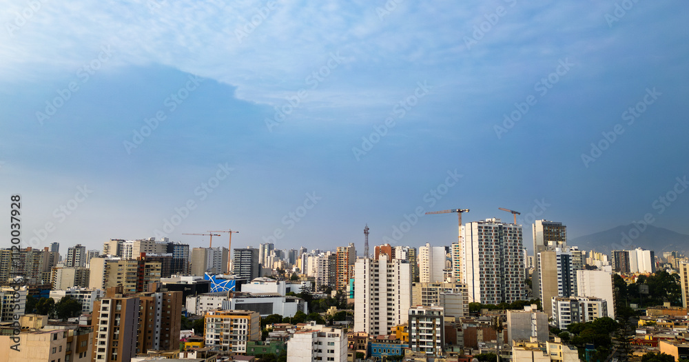 Aerial view of a modern district of the city of lima on a sunny summer afternoon with a beautiful clear blue sky