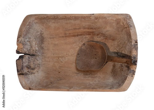 ancient wooden trough with ladle on white, isolated photo