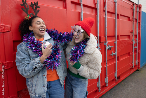 Female friends dressed up for a Christmas party photo