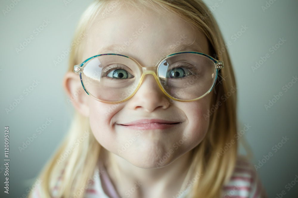 Portrait of a Girl wearing glasses being goofy and pulling a funny face Portrait of a Girl wearing glasses being goofy and pulling a funny face