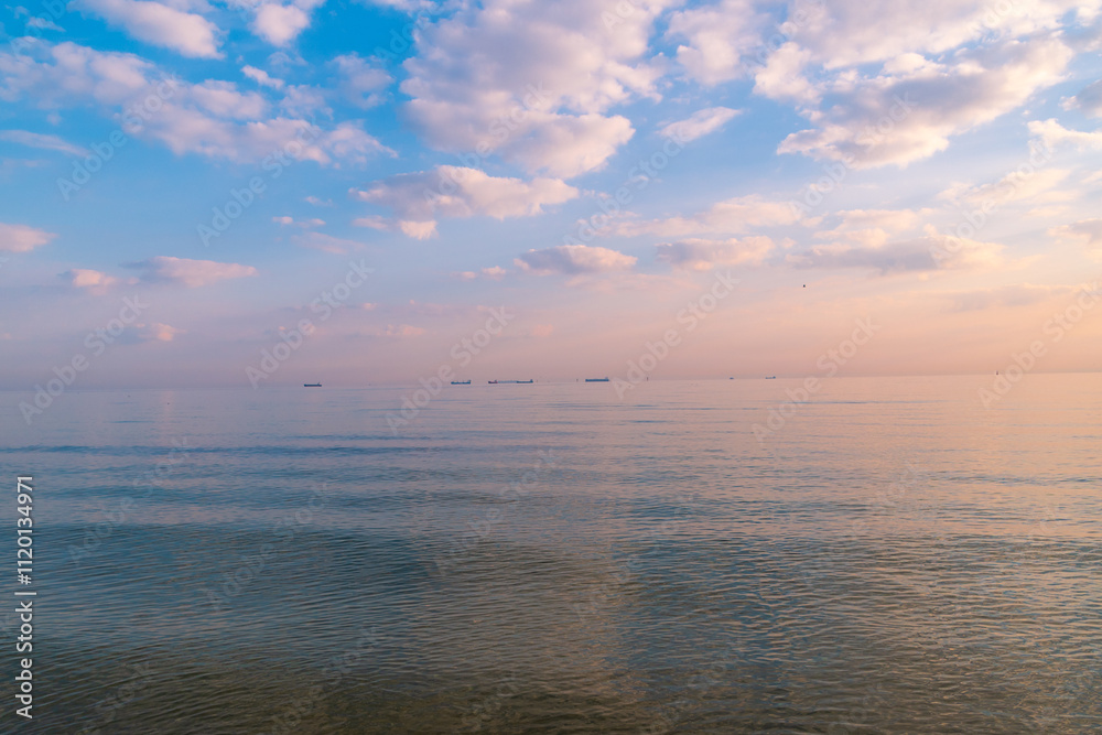 Fototapeta premium Sunset over the sea. Beautiful seascape. Evening twilight. Natural background.