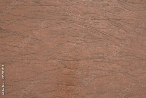 Texture of sand on an ocean beach at low tide photo