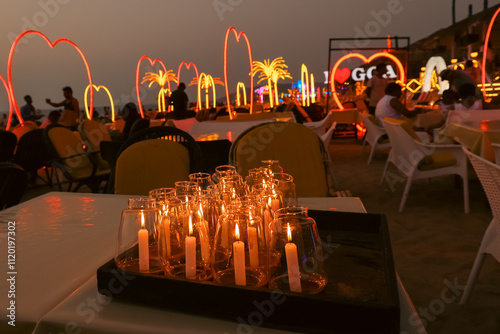 Photography I Love Goa sign illuminated at night outside a tourist beach bar in North Goa India