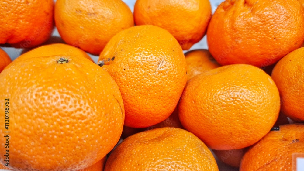 Citrus fruits. Close up of citrus fruits in group and sale in fruits market. Citrus fruits is a genus of flowering trees and shrubs. Oranges, lemons and limes. Citrus fruits. Close up of citrus fruits in group and sale in fruits market. Citrus fruits is a genus of flowering trees and shrubs. Oranges, lemons and limes.