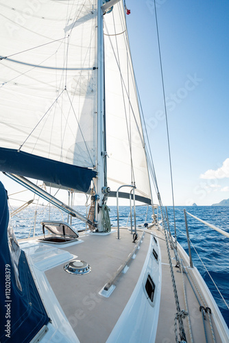 Beautiful charter sailing yacht sailing in the Caribbean with full sails up on a beautiful sunny day