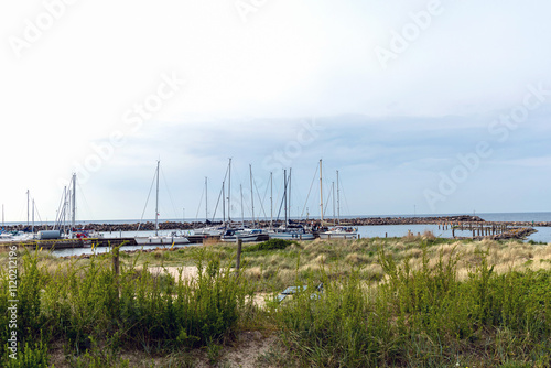 Sea pier with boats and yachts at sunset. Bornholm  Denmark