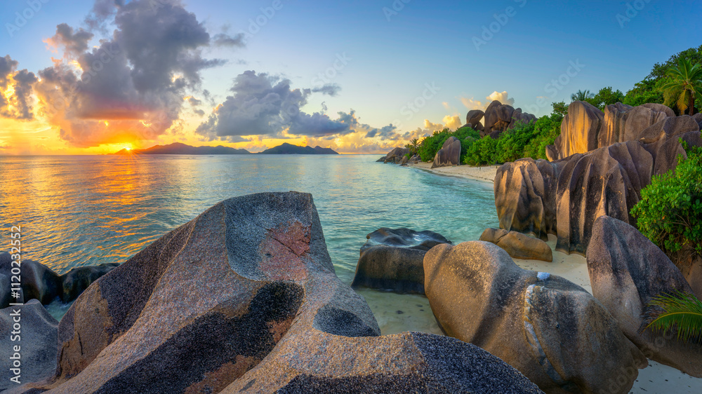 sunset at tropical beach anse source d'argent on la digue on the seychelles