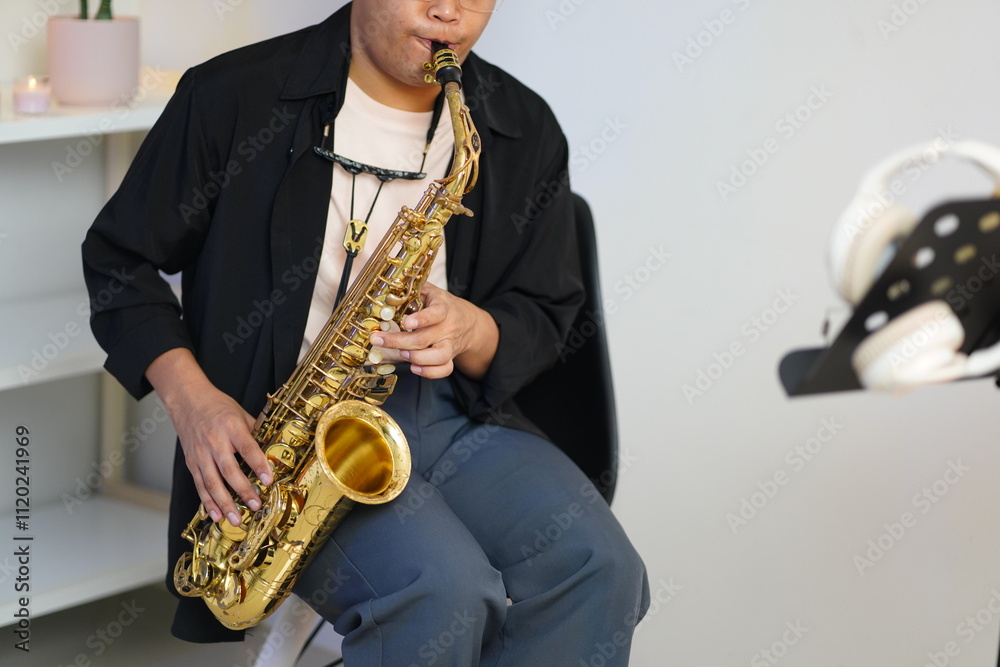 Fototapeta premium Working Asians are learning international musical skills at home