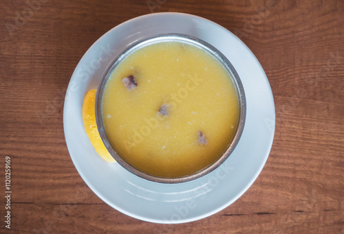 Traditional Tripe Soup with Spoon in Bowl	 photo